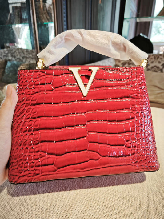 Red Crocodile-Embossed Structured Handbag with Gold 'V' Accent and Detachable Strap