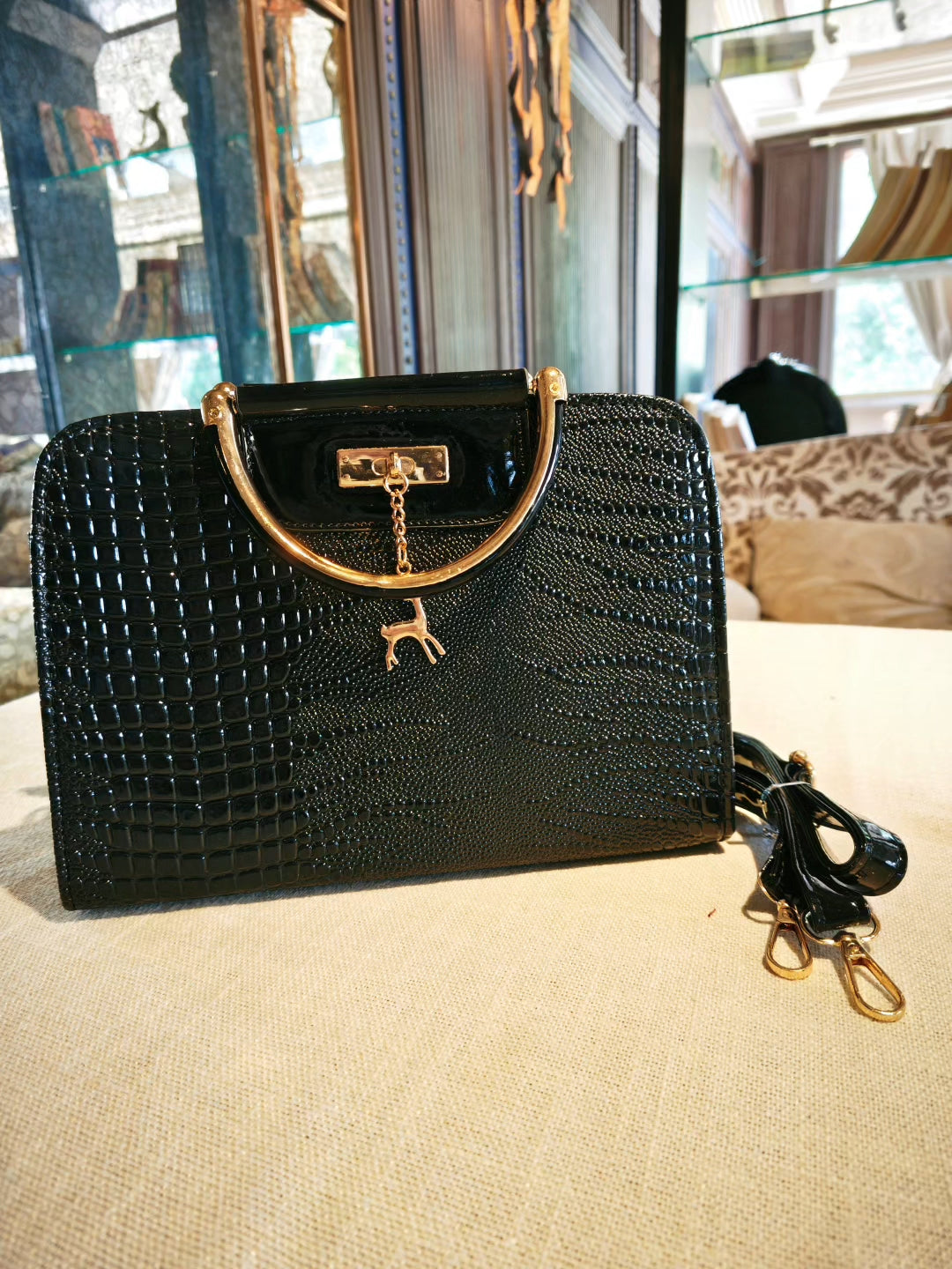 Black Crocodile-Embossed Top-Handle Boston Bag with Golden Deer Charm and Detachable Strap