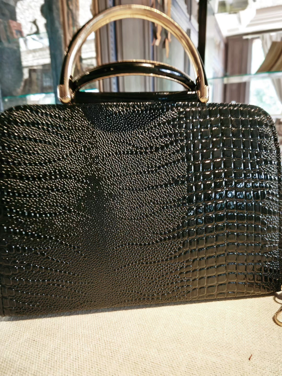 Black Crocodile-Embossed Top-Handle Boston Bag with Golden Deer Charm and Detachable Strap