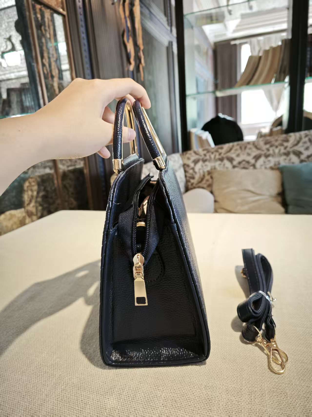 Navy Blue Textured Top-Handle Boston Bag with Golden Deer Charm and Detachable Strap