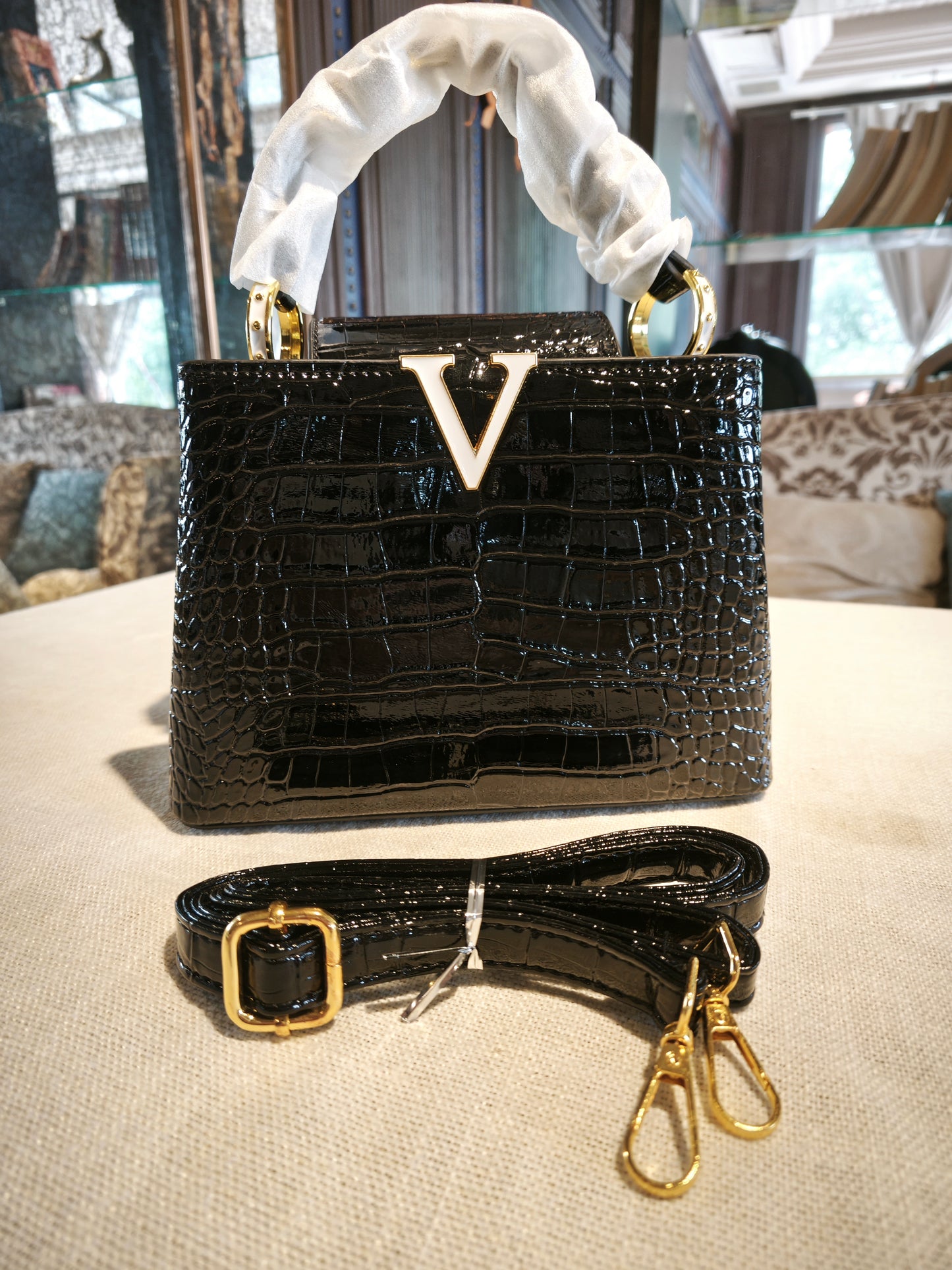 Black Crocodile-Embossed Structured Handbag with Gold 'V' Accent and Detachable Strap