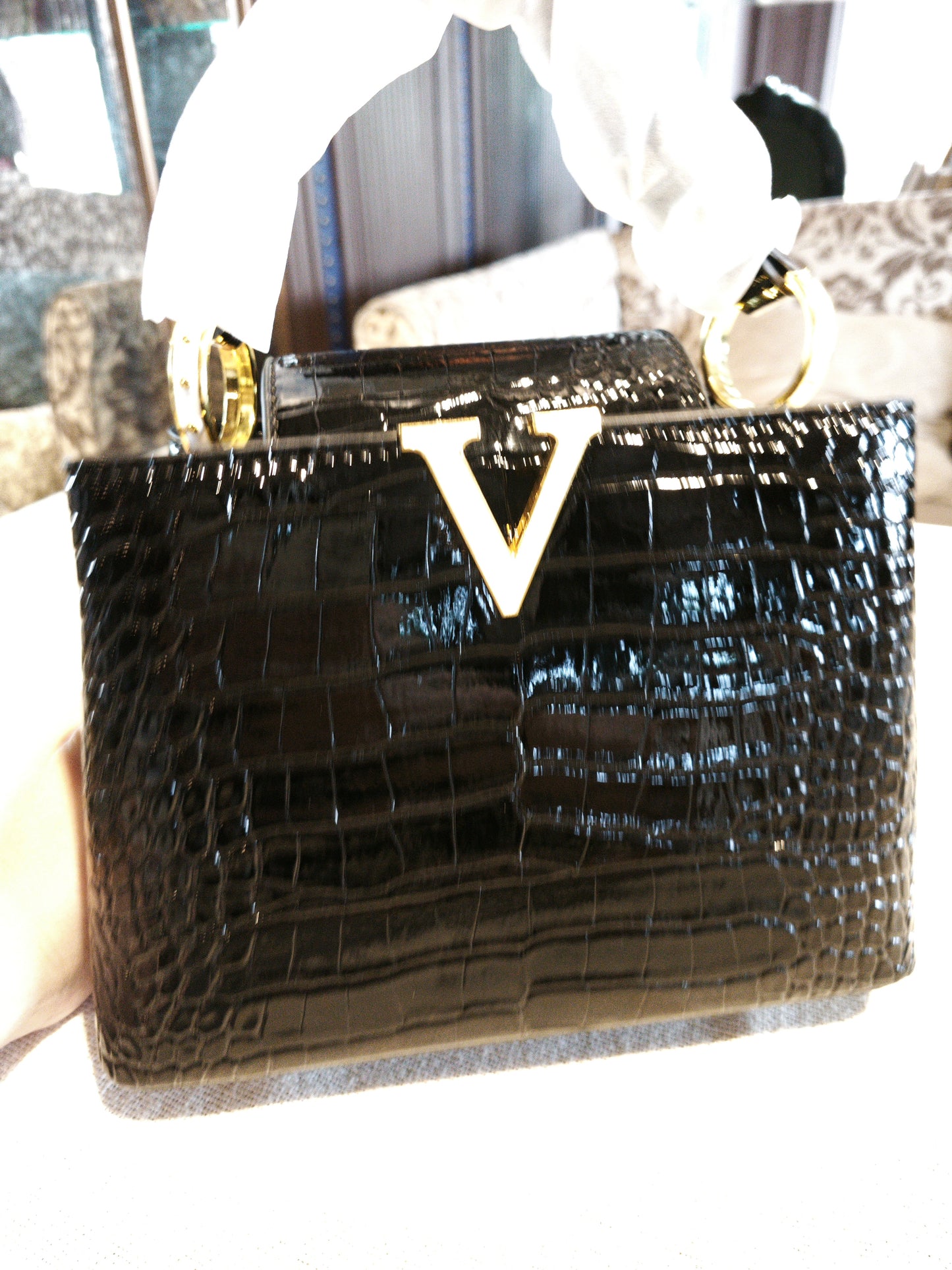 Black Crocodile-Embossed Structured Handbag with Gold 'V' Accent and Detachable Strap