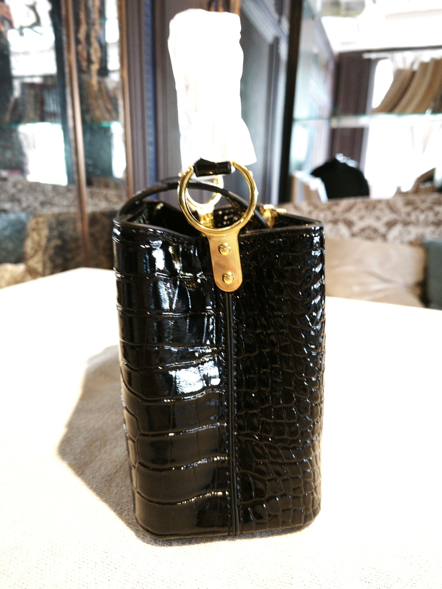 Black Crocodile-Embossed Structured Handbag with Gold 'V' Accent and Detachable Strap