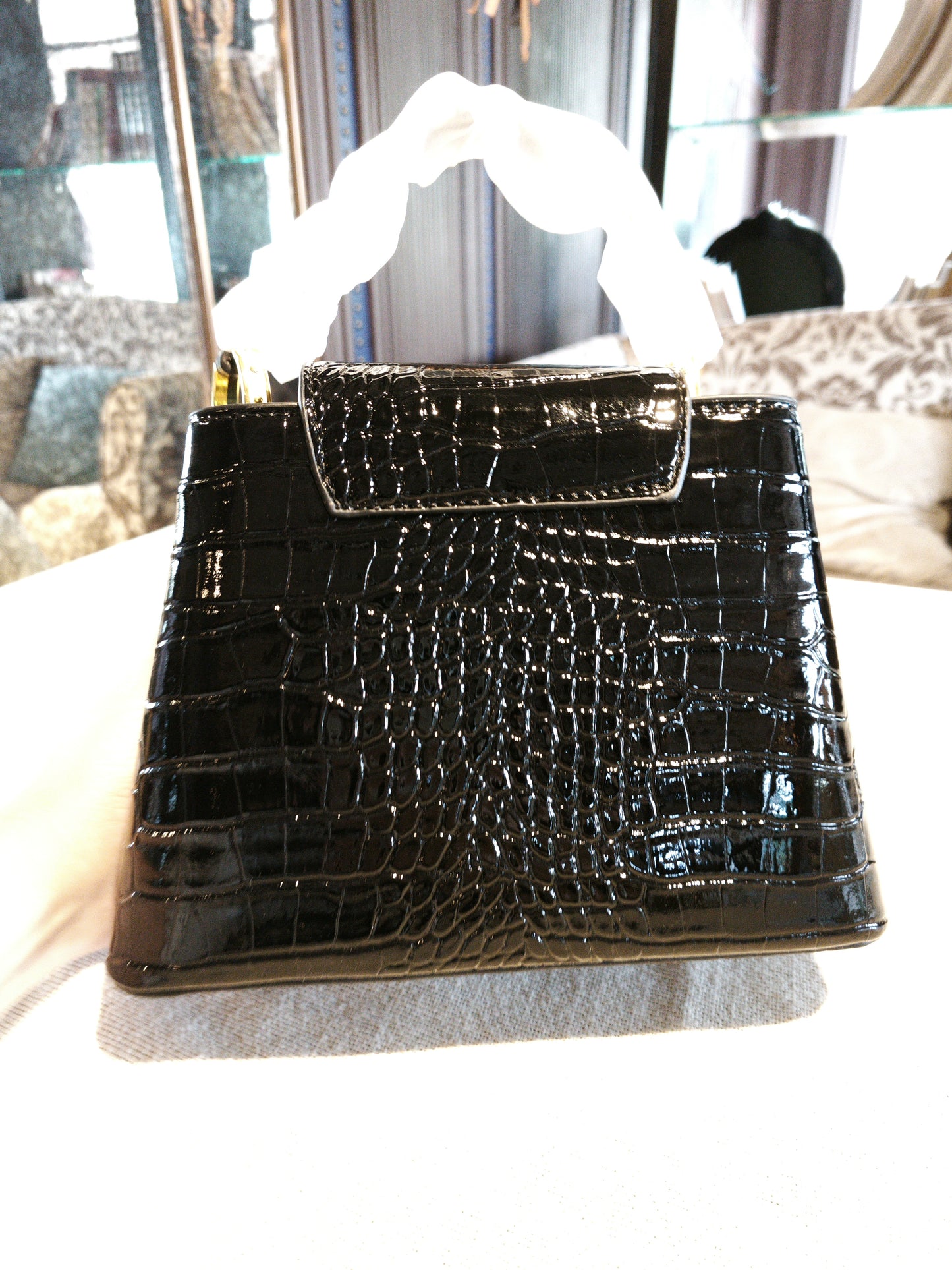 Black Crocodile-Embossed Structured Handbag with Gold 'V' Accent and Detachable Strap