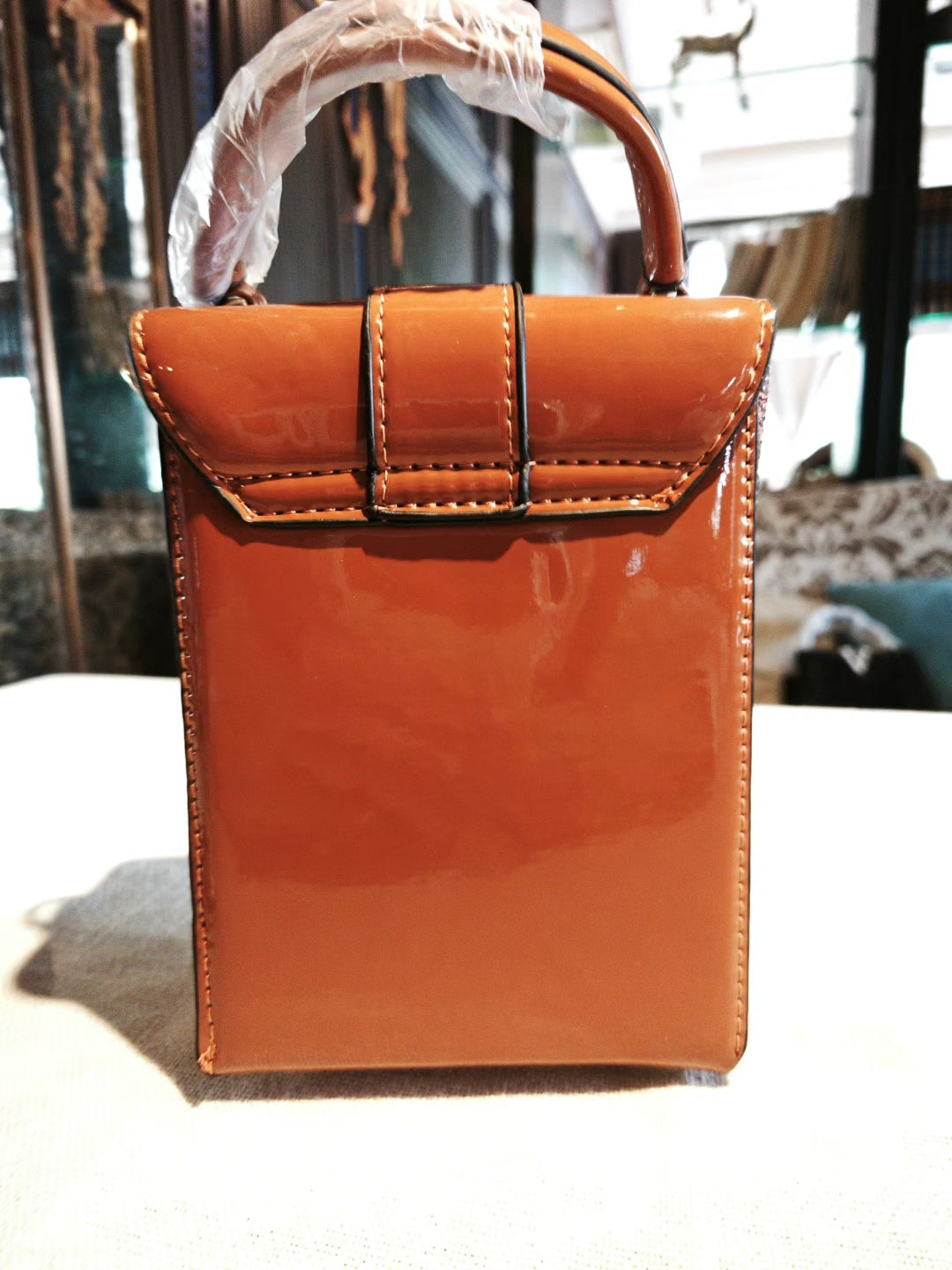 Brown Textured Structured Boxy Bag with Decorative Lock, Detachable Strap and Scarf